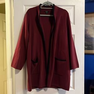 Long wine knit jacket with black trim.